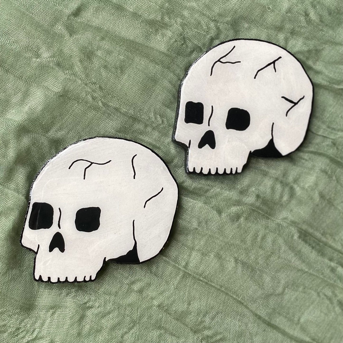 This is a photo of two skull magnets. They have slight differences as they are hand painted.